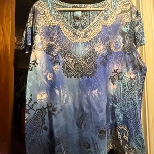 Blue, black, and white V neck shirt with short sleeves